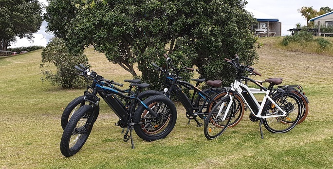 Range of e-bikes parked outside